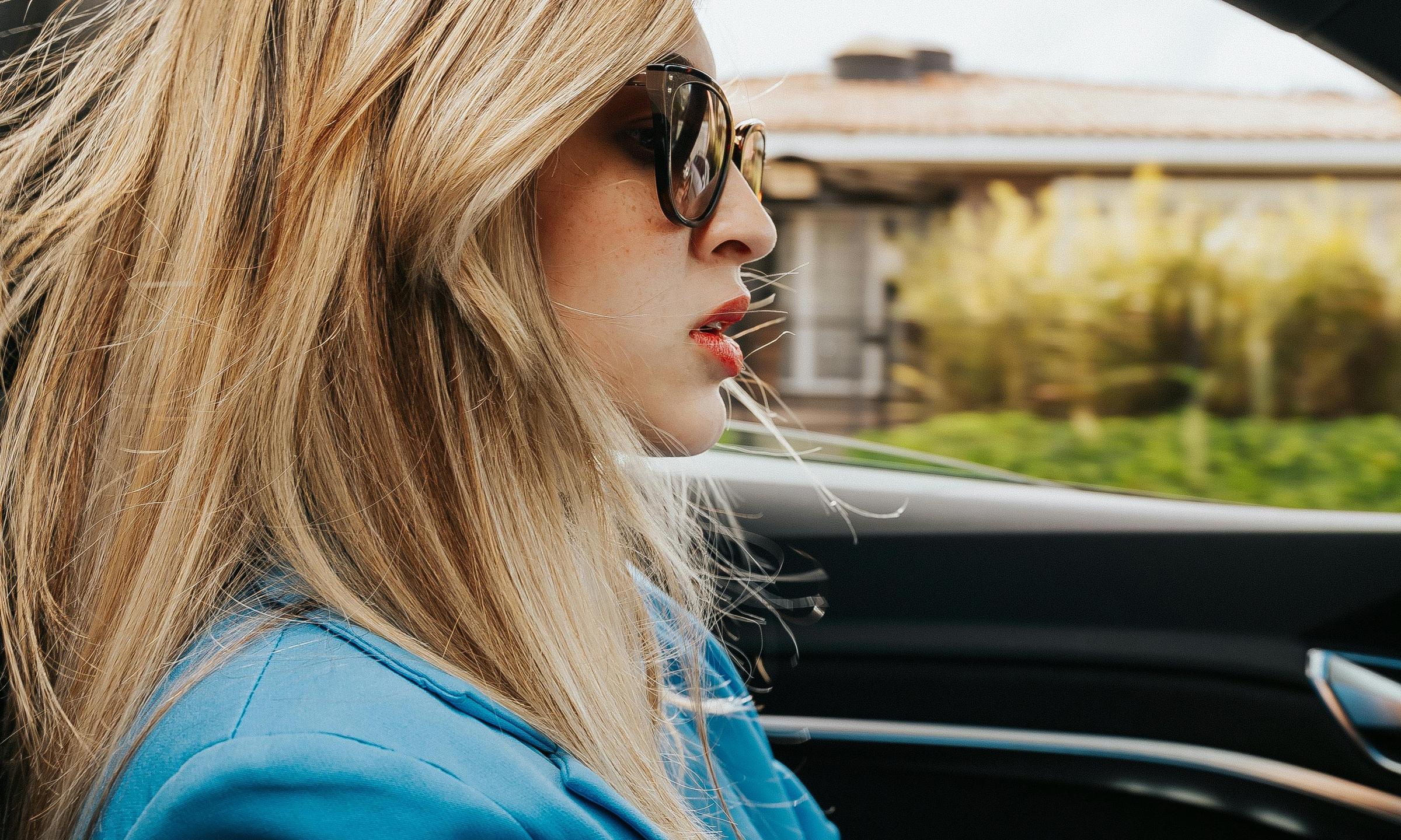 A woman driving a car | Source: Pexels