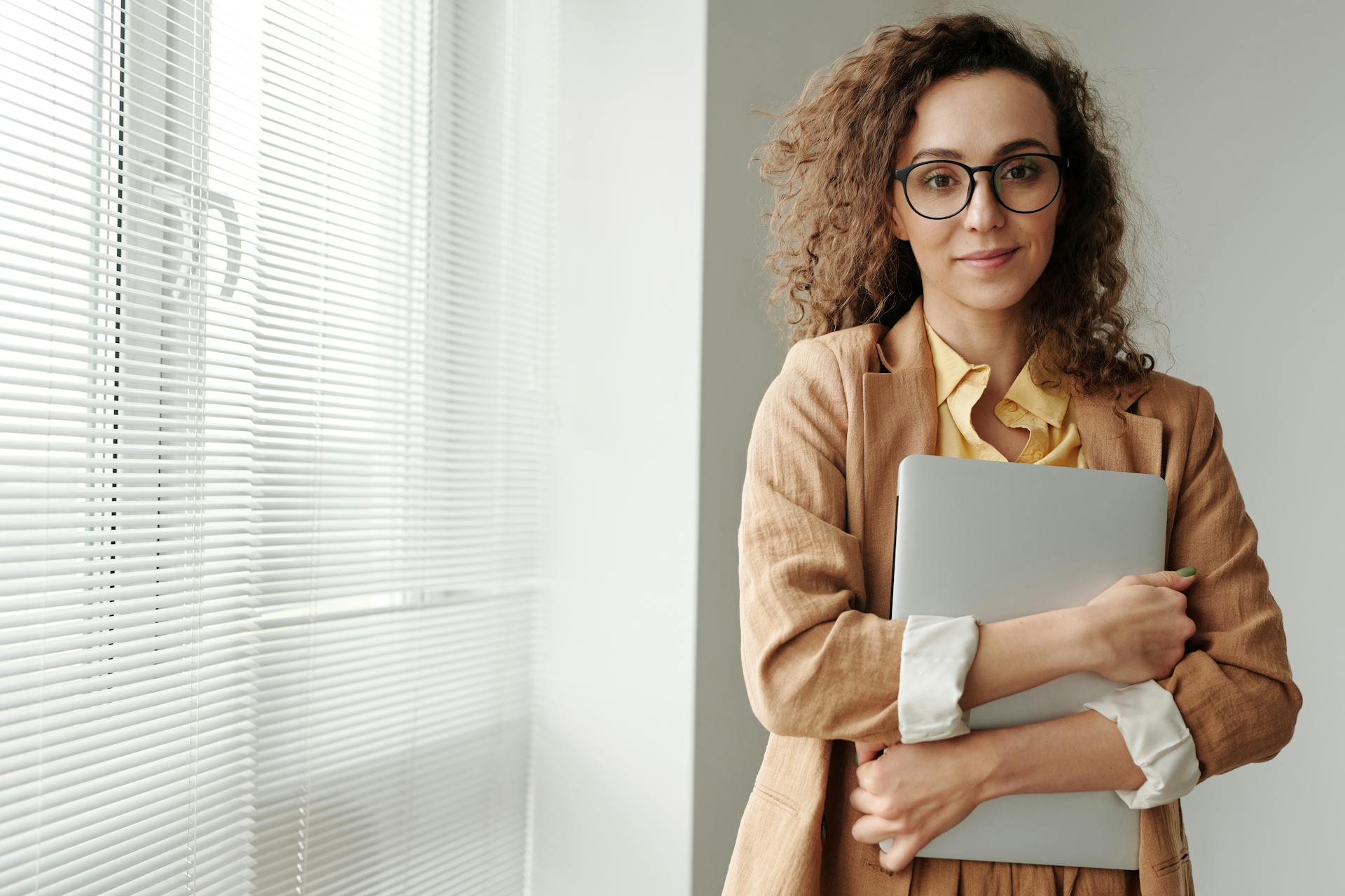 A young woman holding a file | Source: Pexels