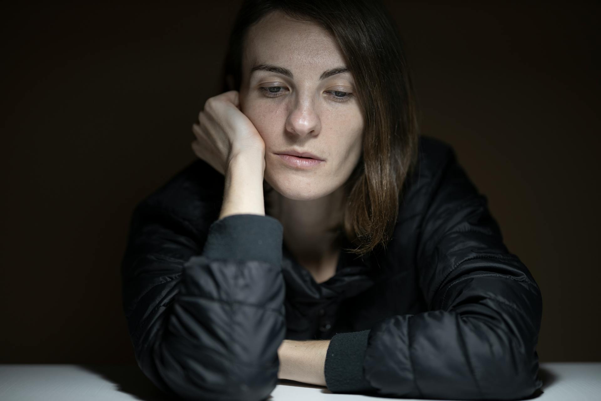 A sad woman holding her face | Source: Pexels