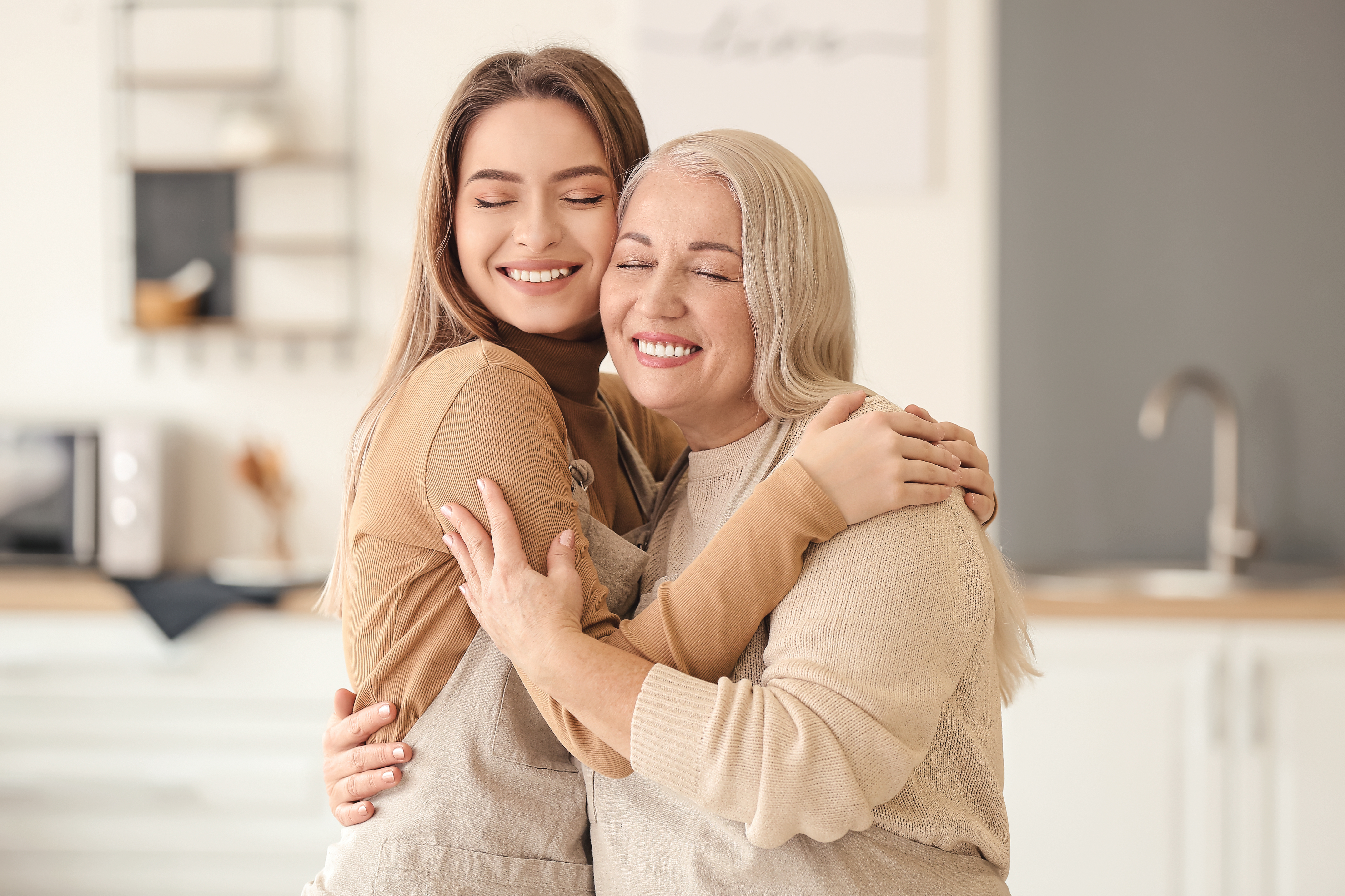 A young woman hugging her mom | Source: Shutterstock