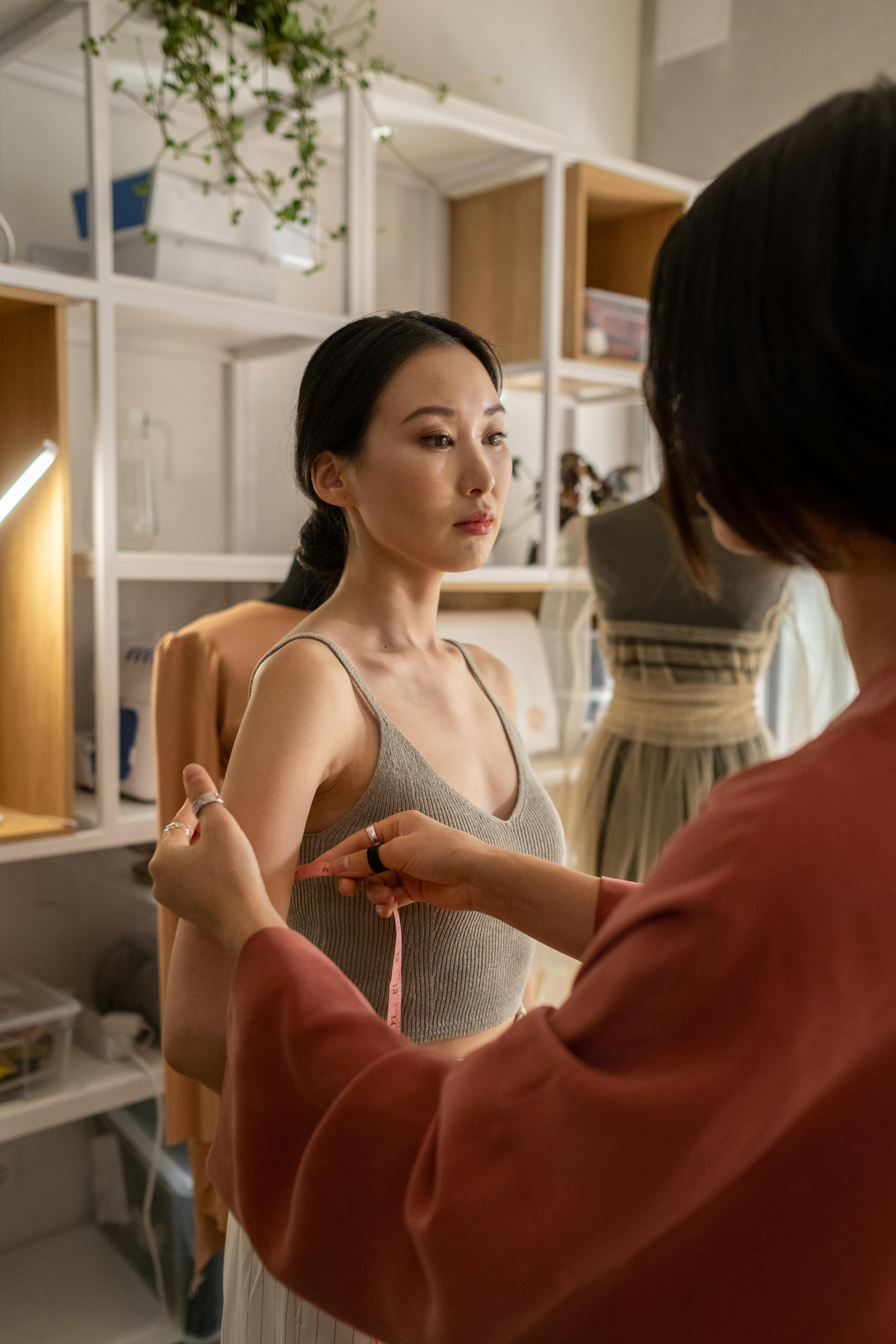 A woman being measured by tailor | Source: Pexels