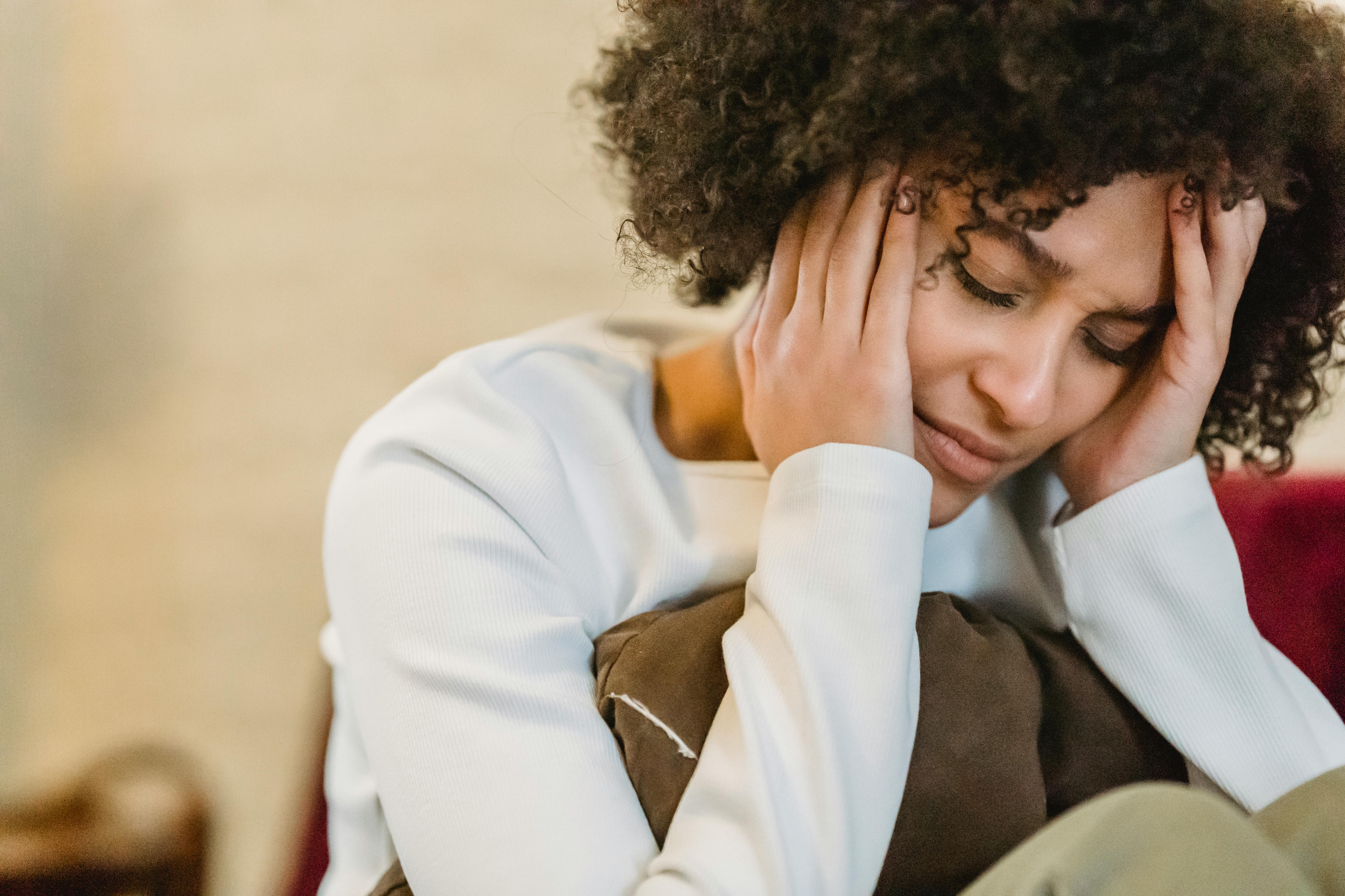 A depressed woman at home | Source: Pexels