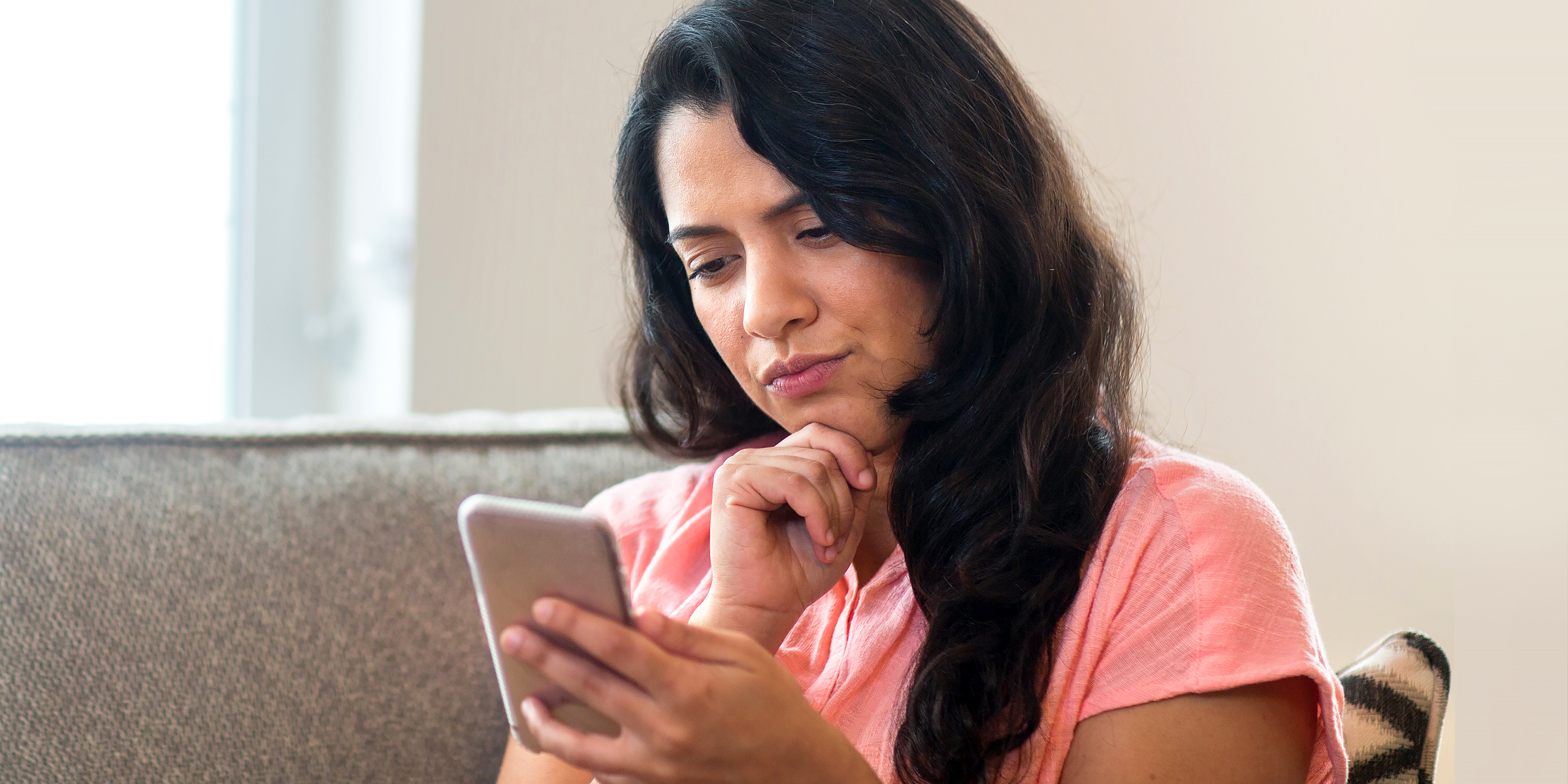 Woman on her phone | Source: Shutterstock