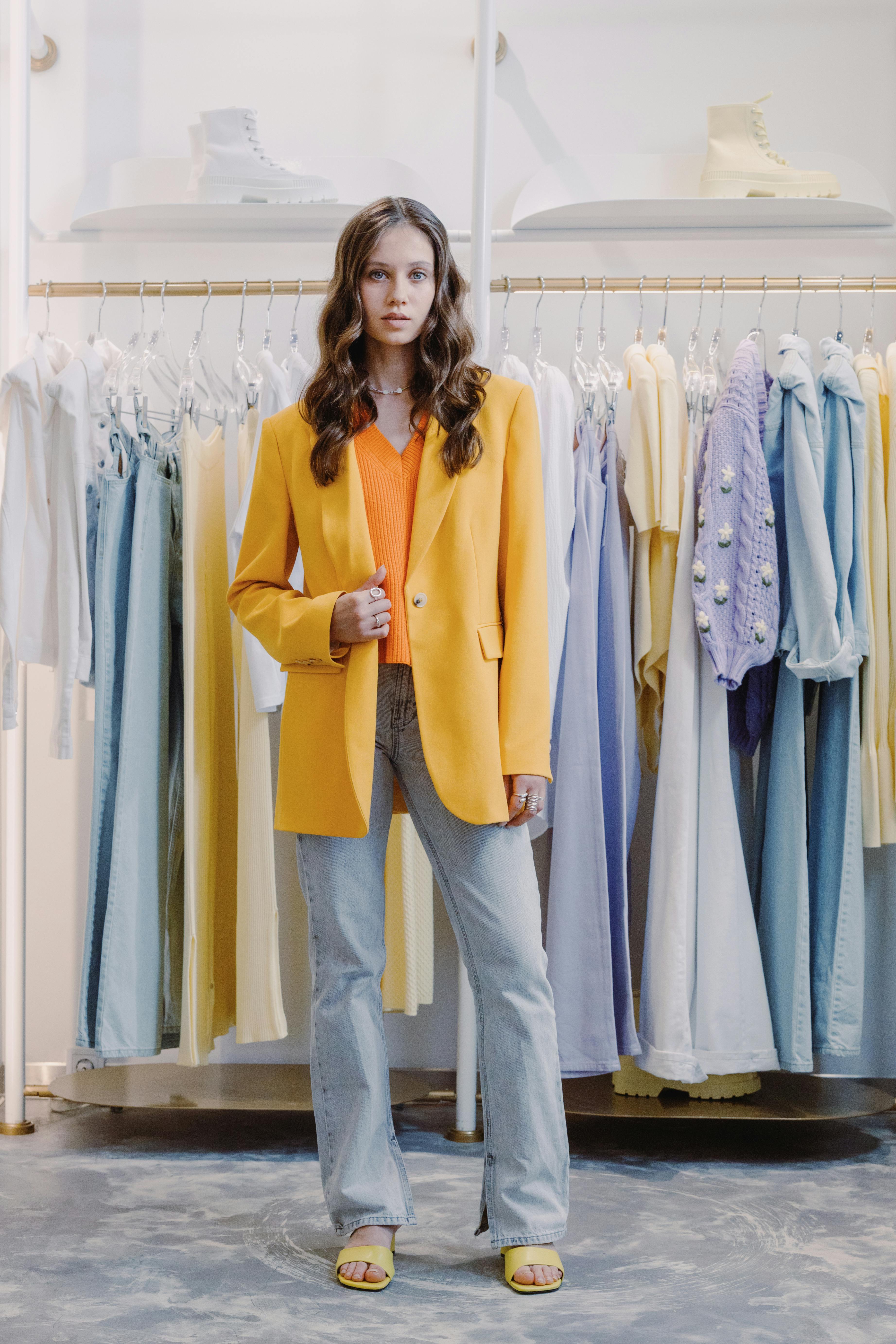 A woman dressed up and posing in a store | Source: Pexels