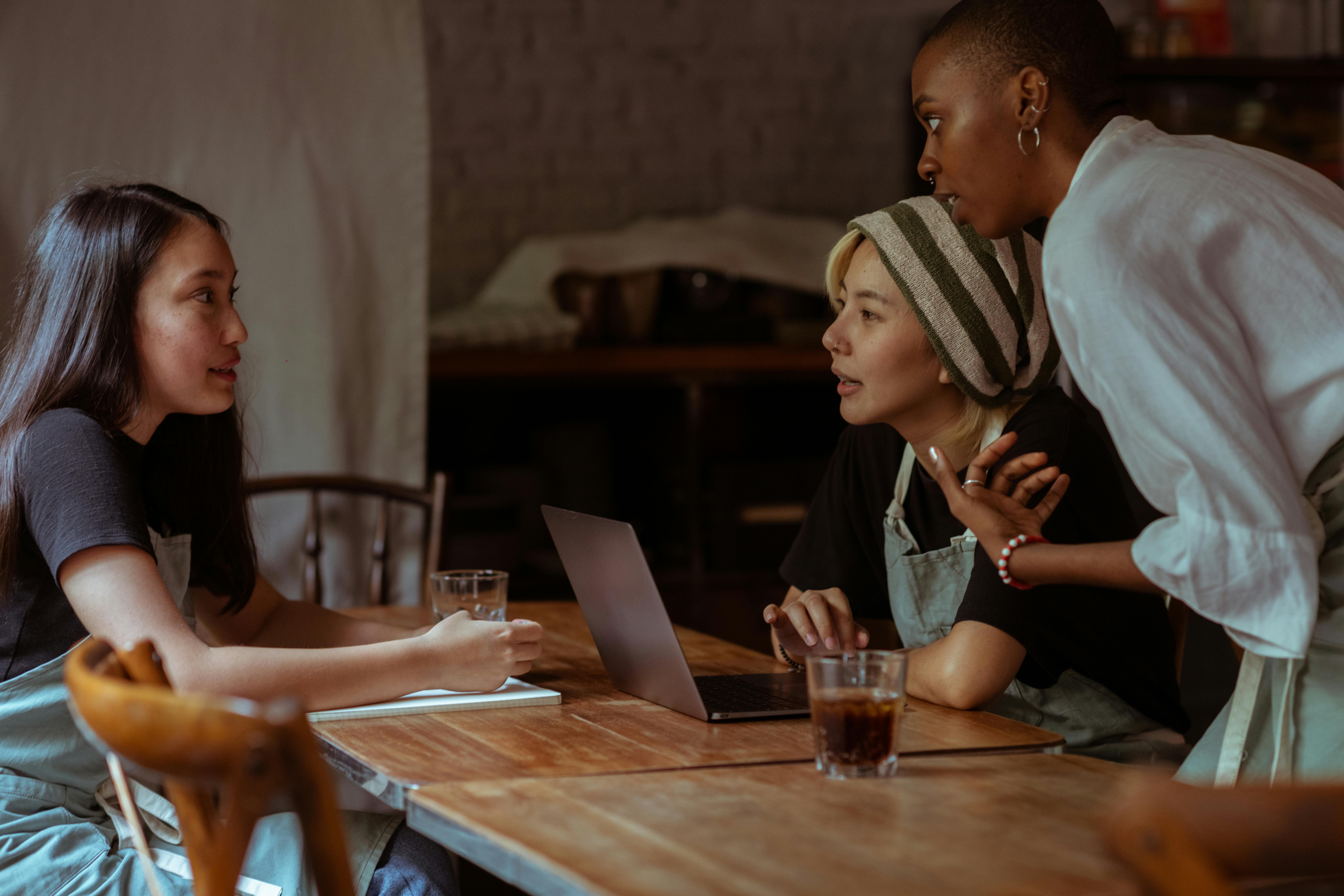 A group of people chatting in a small restaurant | Source: Pexels