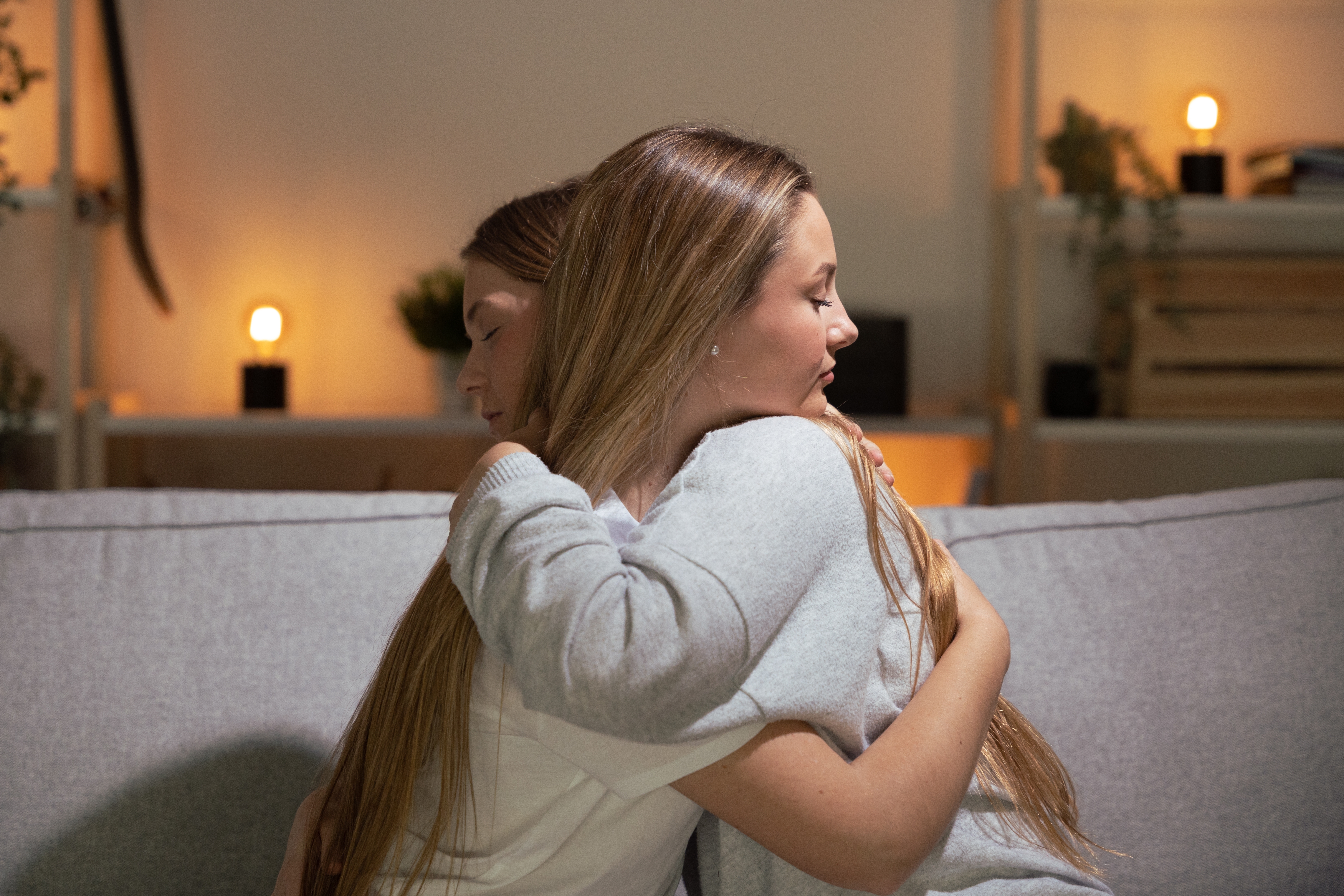 A woman hugging another woman to comfort her | Source: Shutterstock