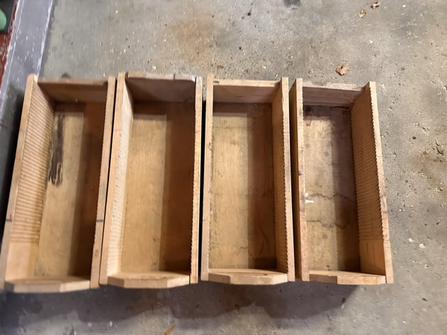 r/whatisthisthing - Four wooden boxes with grooves cut into the long sides of interior - what are these?